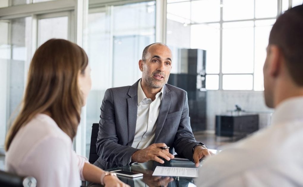 financial-advisor-with-clients-PQ22HHZ-1024x683-1